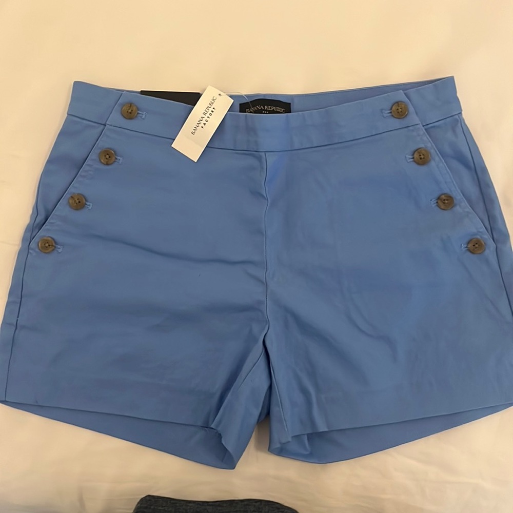 Blue shorts with button detail on pockets
